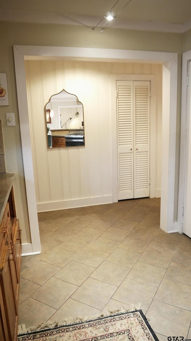 hallway featuring light tile patterned floors