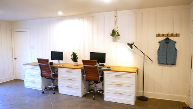 office featuring wood walls