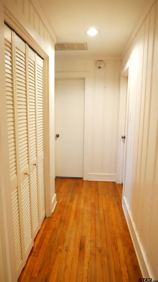 hall with light hardwood / wood-style flooring