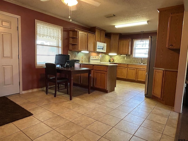 kitchen featuring sink, tasteful backsplash, ceiling fan, light tile patterned floors, and white appliances