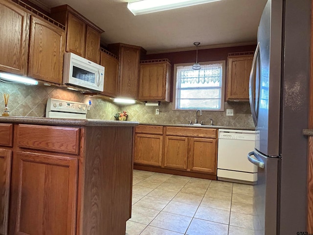 kitchen featuring ornamental molding, backsplash, decorative light fixtures, light tile patterned floors, and white appliances