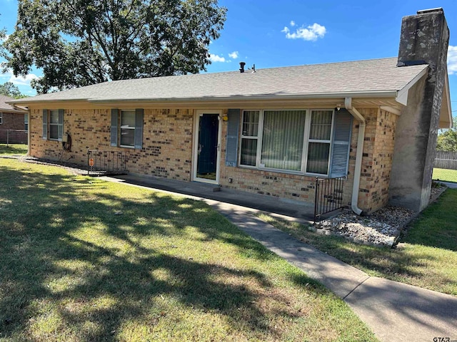 ranch-style house with a front lawn