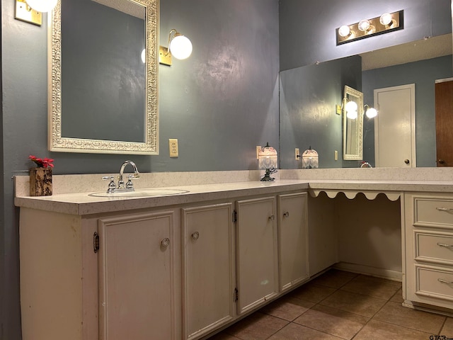 bathroom with vanity and tile patterned flooring