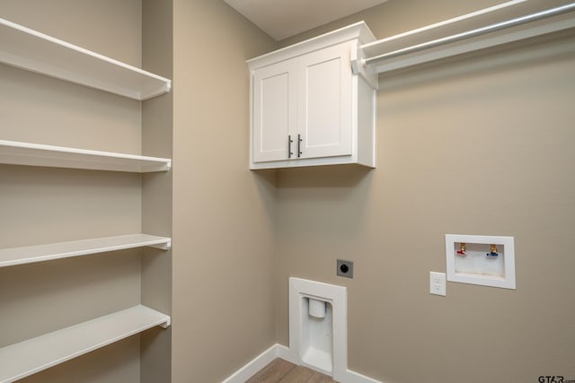 washroom featuring cabinets, electric dryer hookup, and washer hookup