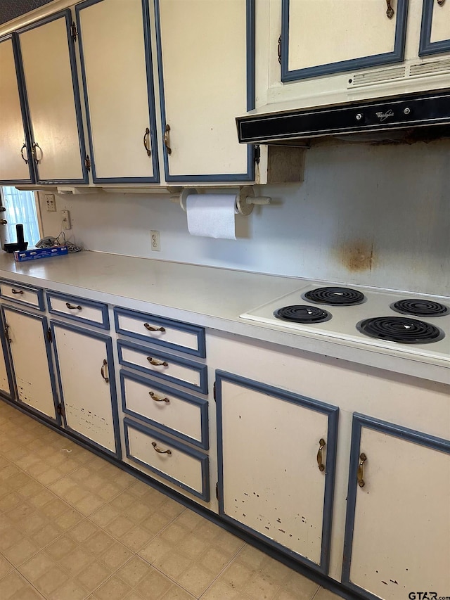 kitchen featuring extractor fan and white electric cooktop