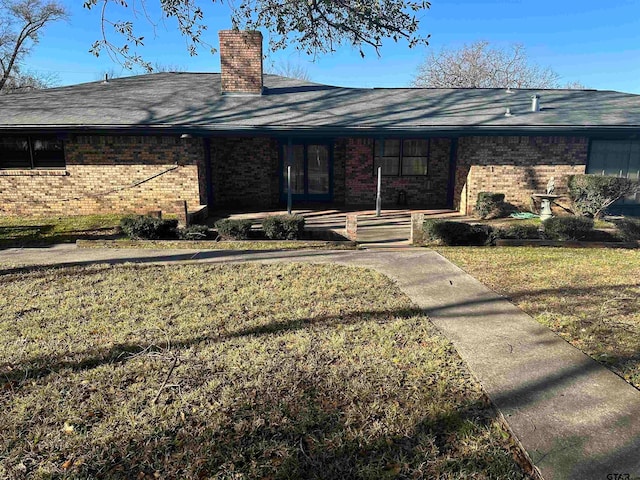 exterior space with a porch and a yard