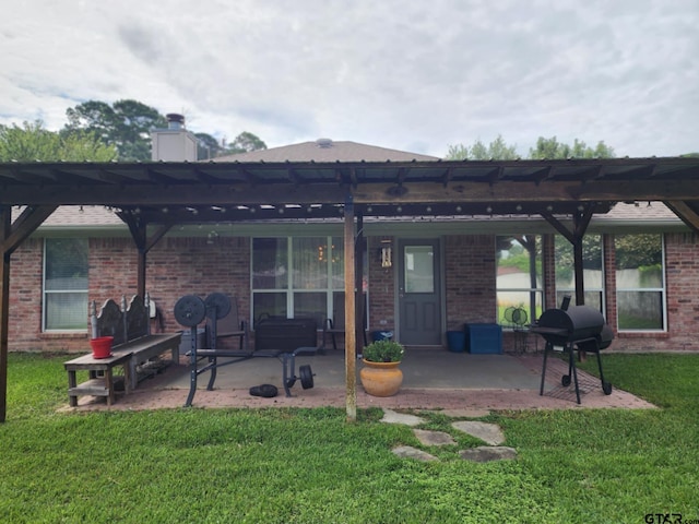 670 Frederick Cir, Flint, TX 75762 - back of property featuring a pergola, a lawn, brick siding, and a patio area