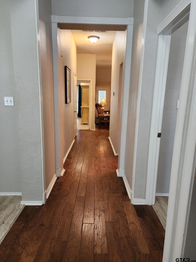 670 Frederick Cir, Flint, TX 75762 - hallway with dark wood finished floors and baseboards