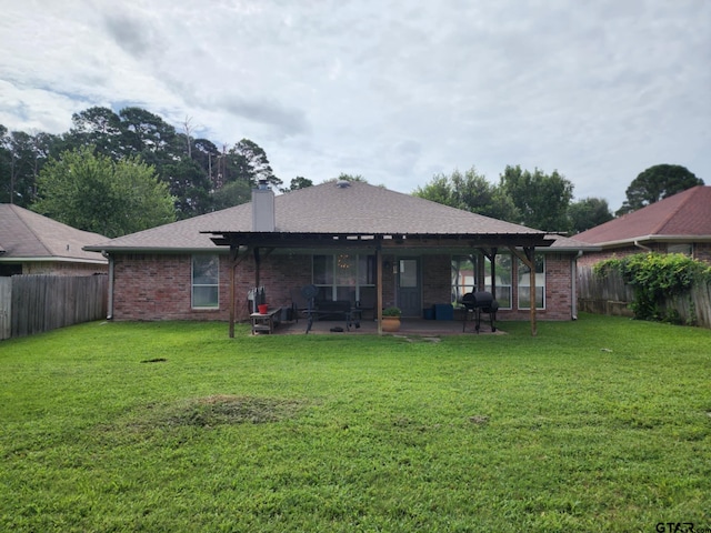 670 Frederick Cir, Flint, TX 75762 - back of house featuring a patio area, a fenced backyard, a chimney, and brick siding