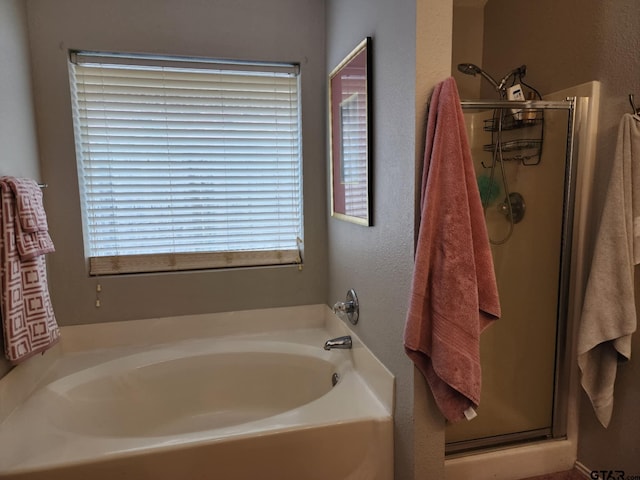 670 Frederick Cir, Flint, TX 75762 - bathroom with a stall shower and a bath