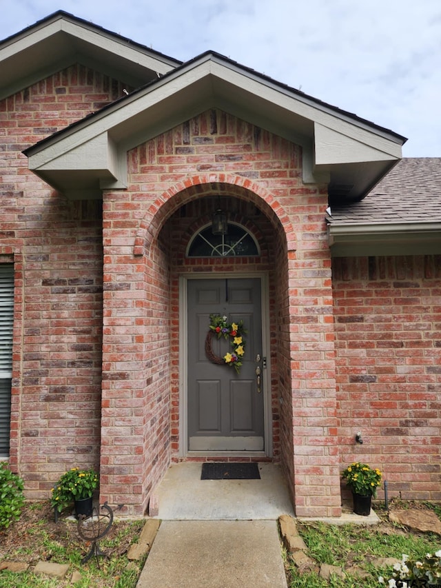 670 Frederick Cir, Flint, TX 75762 - view of exterior entry with brick siding and roof with shingles
