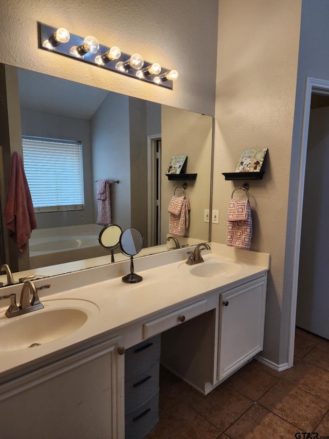 670 Frederick Cir, Flint, TX 75762 - full bathroom with double vanity, tile patterned flooring, and a garden tub