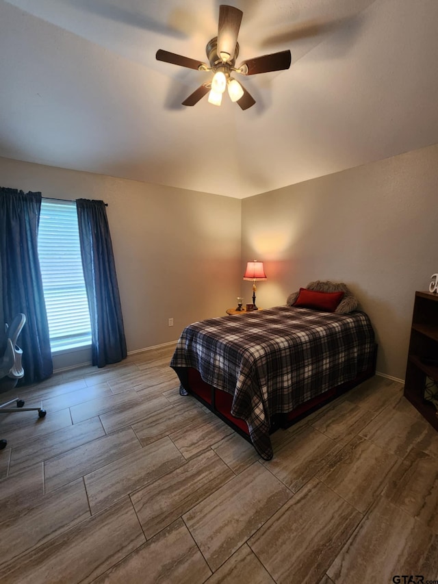 670 Frederick Cir, Flint, TX 75762 - bedroom with wood tiled floors and a ceiling fan