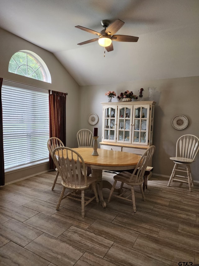 670 Frederick Cir, Flint, TX 75762 - dining space with lofted ceiling, a ceiling fan, and dark wood-style flooring