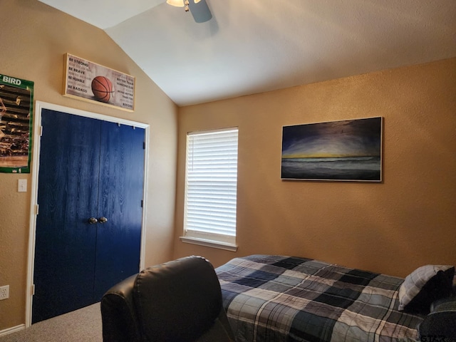 670 Frederick Cir, Flint, TX 75762 - bedroom with vaulted ceiling, carpet flooring, a closet, ceiling fan, and a textured wall