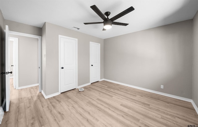 unfurnished bedroom featuring ceiling fan and light wood-type flooring