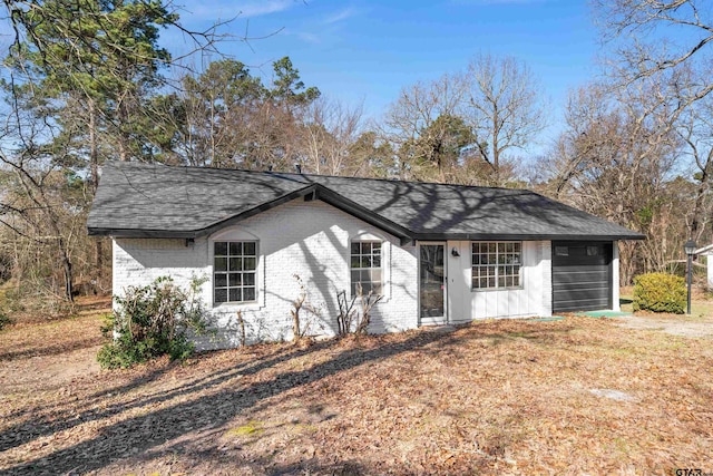 single story home with a garage