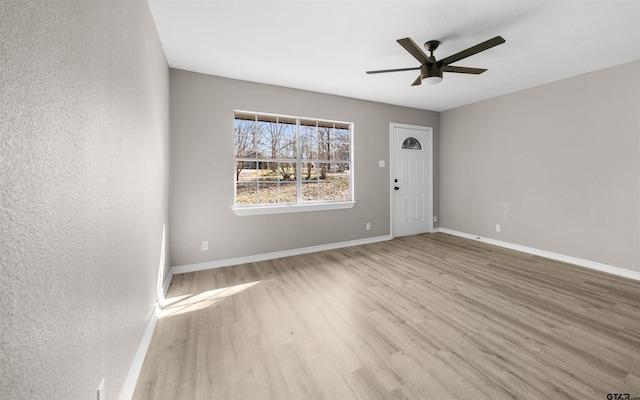 unfurnished room featuring ceiling fan and light hardwood / wood-style flooring