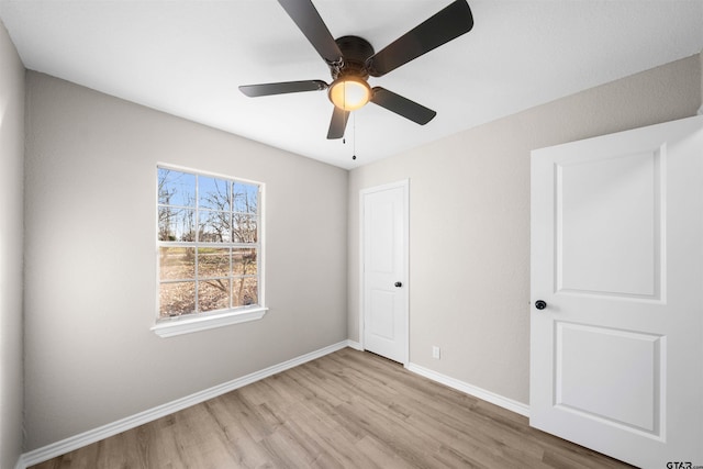 unfurnished bedroom with a closet, ceiling fan, and light hardwood / wood-style flooring