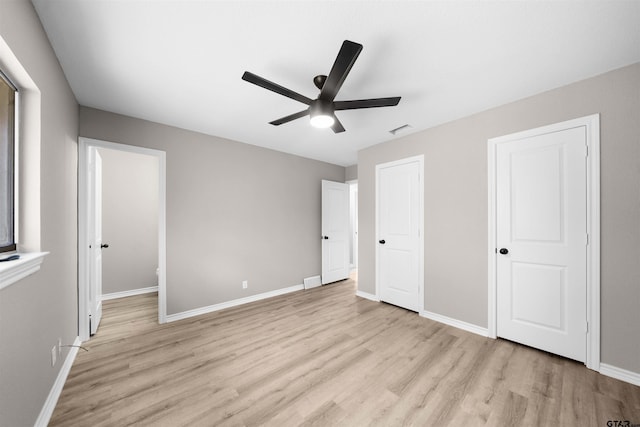 unfurnished bedroom featuring ceiling fan and light hardwood / wood-style floors