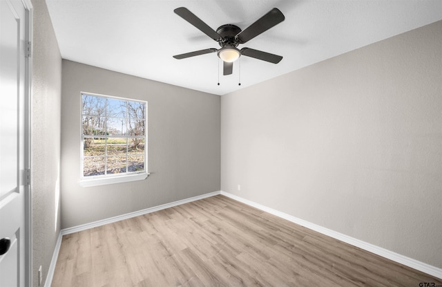 unfurnished room with ceiling fan and light hardwood / wood-style flooring