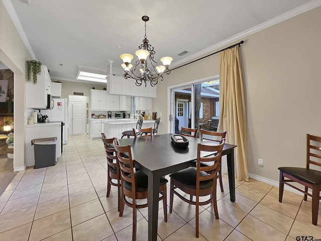 dining room featuring light tile patterned floors, visible vents, a chandelier, and crown molding