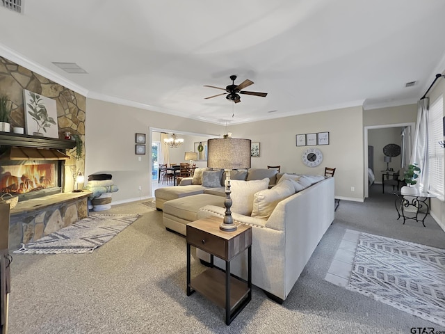 living area featuring ornamental molding, visible vents, a fireplace, and baseboards