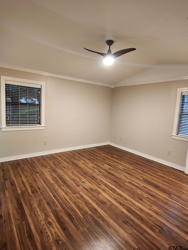 empty room with dark hardwood / wood-style floors, ceiling fan, and crown molding