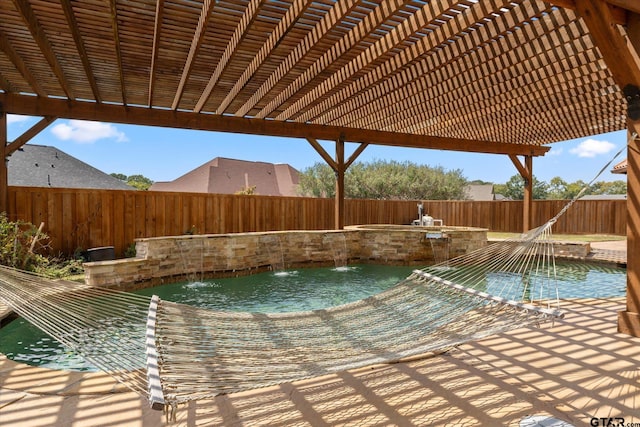 view of pool with pool water feature and a patio area