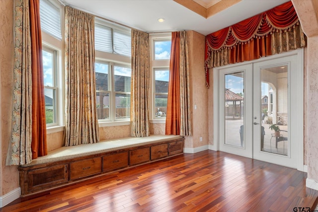 unfurnished room featuring hardwood / wood-style floors and french doors