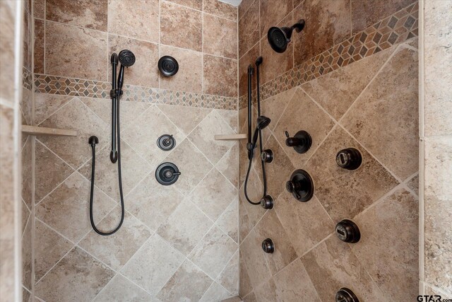 bathroom with tiled shower