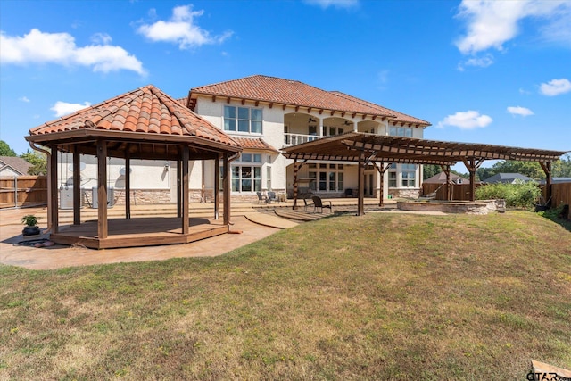 back of house featuring a patio, a gazebo, a yard, and a pergola