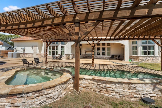 view of swimming pool with central AC unit, a patio, a pergola, and an in ground hot tub