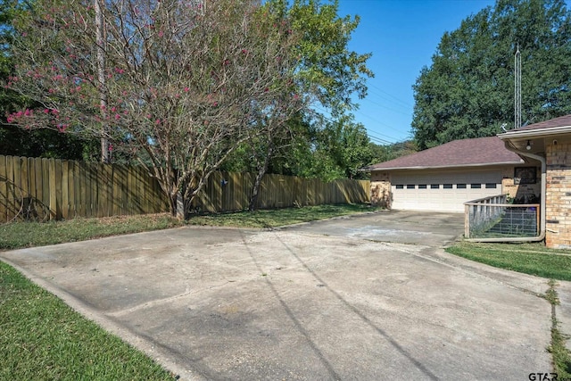 113 Granada Sq, Canton, TX 75103 - view of patio / terrace featuring driveway and a garage