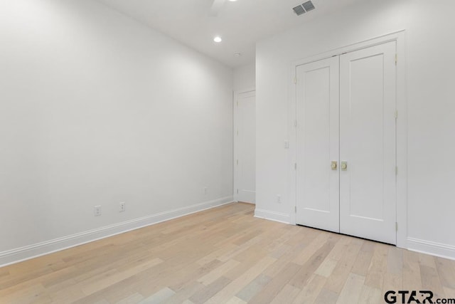 unfurnished bedroom featuring recessed lighting, visible vents, baseboards, and light wood finished floors