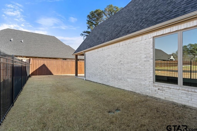 view of yard featuring a fenced backyard