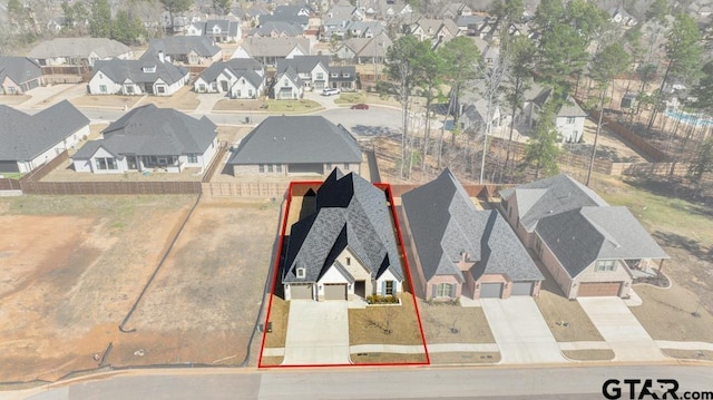 birds eye view of property with a residential view