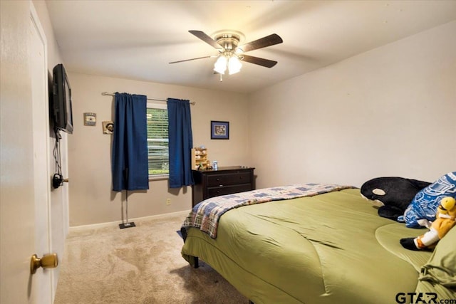 315 Ridgecrest Dr, Tyler, TX 75701 - carpeted bedroom with baseboards and a ceiling fan