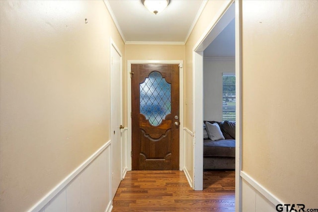 315 Ridgecrest Dr, Tyler, TX 75701 - doorway to outside featuring wood finished floors, ornamental molding, and a wainscoted wall