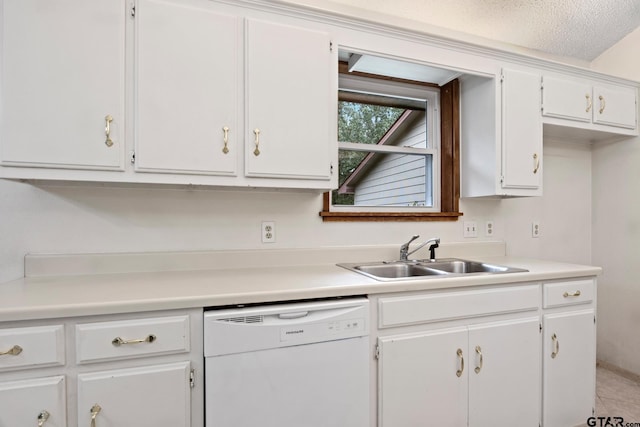 kitchen featuring white cabinetry, sink, white dishwasher, a textured ceiling, and light tile patterned flooring