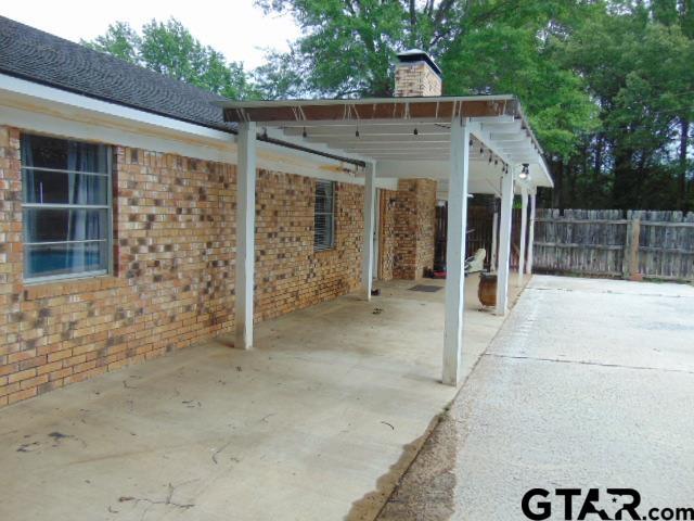 view of patio / terrace featuring fence