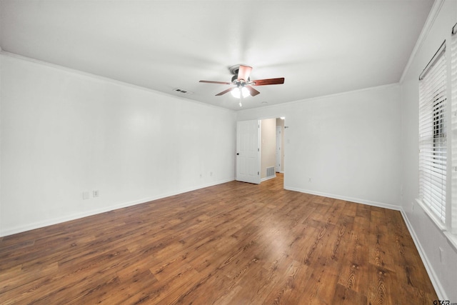 unfurnished bedroom featuring hardwood / wood-style flooring, ceiling fan, ornamental molding, and multiple windows