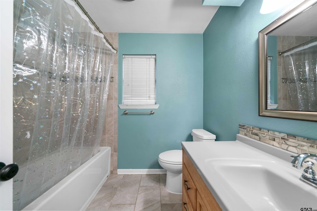 full bathroom featuring vanity, shower / tub combo, and toilet