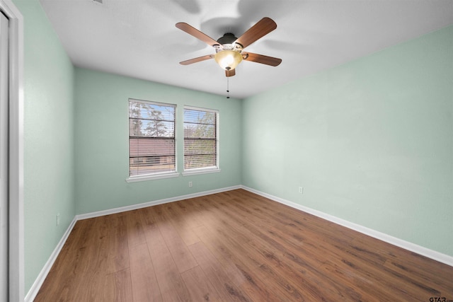 unfurnished room featuring hardwood / wood-style flooring and ceiling fan