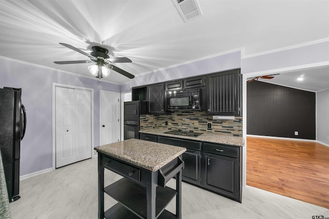 kitchen with black appliances, decorative backsplash, ornamental molding, ceiling fan, and light stone counters