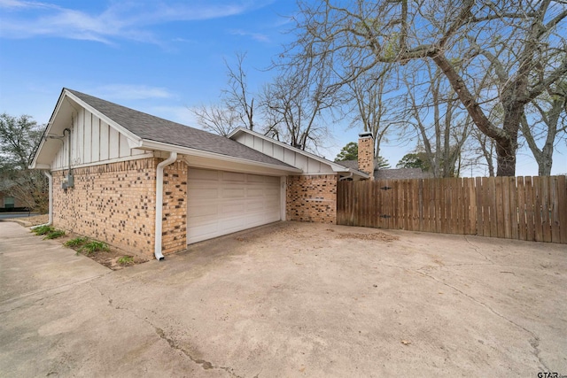 view of side of home with a garage