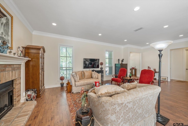 3953 Hanover Pl, Tyler, TX 75701 - living area featuring a brick fireplace, wood finished floors, crown molding, and recessed lighting
