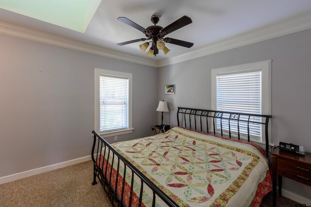 bedroom featuring ornamental molding, carpet flooring, and ceiling fan