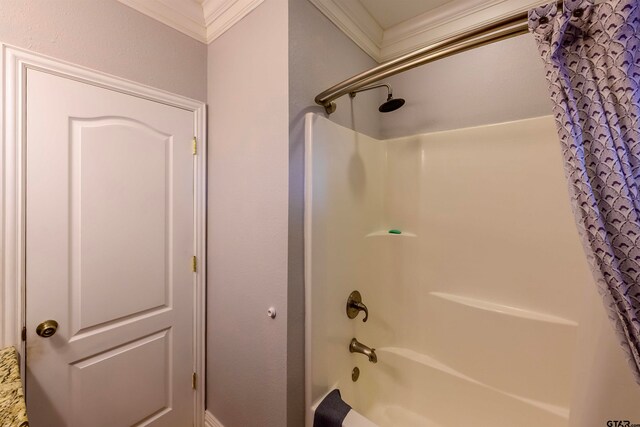 bathroom with shower / bath combination with curtain and ornamental molding