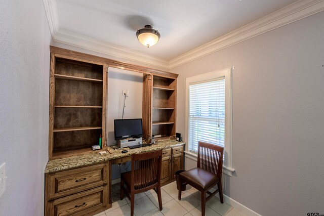 office with light tile patterned floors, built in desk, and ornamental molding